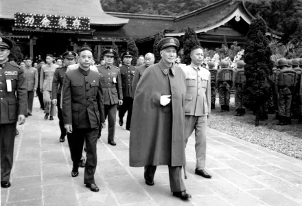 Chinese Nationalist President Chiang Kai-shek, center, and other top Nationalist government officials walk from the Yuanshan Martyrs shrine in Taipei, Taiwan, Tuesday, March 29, 1955. The leaders payed homage to the revolutionary martyrs and those killed in the struggle with the Chinese communists. 