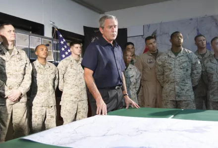 George W. Bush and military members in briefing