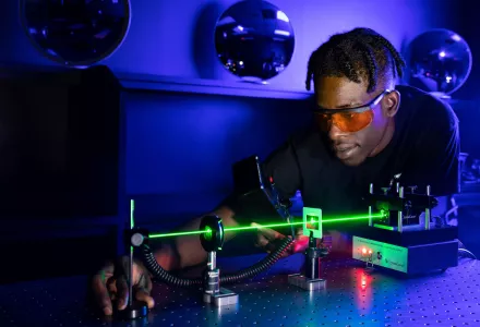 ATE student learning to measure output power from a laser