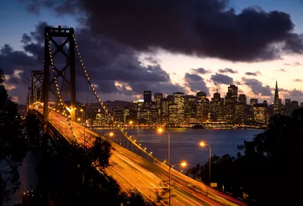 A scene of the Bay Bridge with San Francisco in the background