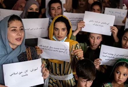 Women and teachers demonstrate inside a private school to demand their rights and equal education for women and girls, during a gathering for National Teachers Day, at a private school in Kabul, Afghanistan, Tuesday, Oct. 5, 2021. (AP Photo/Ahmad Halabisaz)