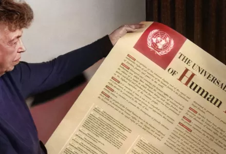 Eleanor Roosevelt holding a poster of the Universal Declaration of Human Rights