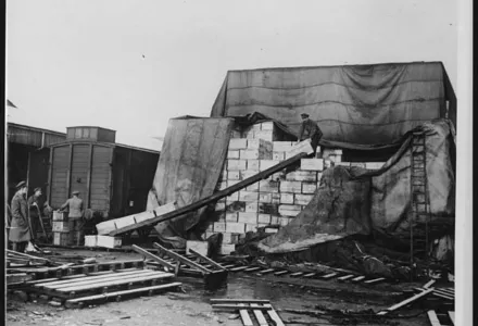 A huge stack of provisions being loaded into trains.