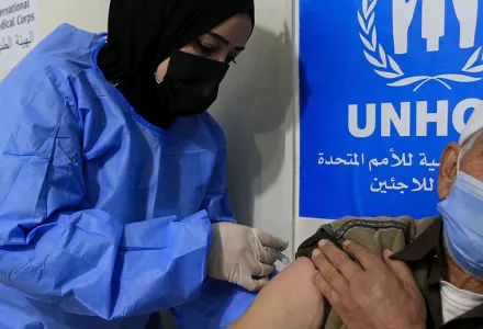 A Syrian refugee receives the Chinese-made Sinopharm coronavirus vaccine at a medical center in the Zaatari refugee camp, in Mafraq, about 80 km (50 miles) north of the Jordanian capital Amman, Monday, Feb. 15, 2021.