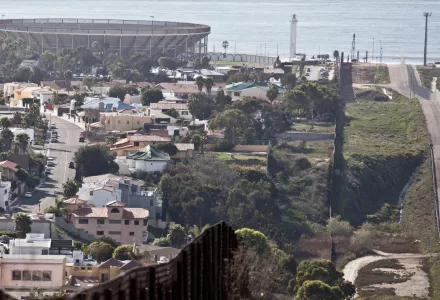 The US-Mexico border fence with Tijuana, Mexico, on the left, the Pacific Ocean in the background