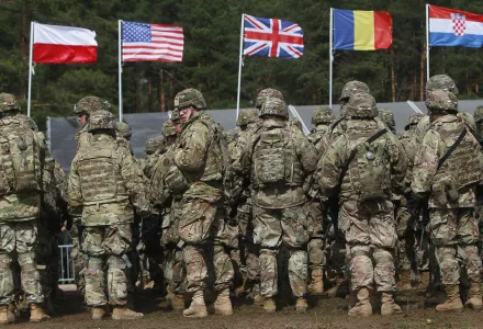 U.S. troops, part of a NATO mission to enhance Poland's defence, are getting ready for an official welcoming ceremony in Orzysz, northeastern Poland, Thursday, April 13, 2017.