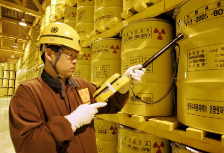 A worker checks the radioactivity of drums containing nuclear waste at Yonggwang Nuclear Power Site in Yonggwang, South Korea.