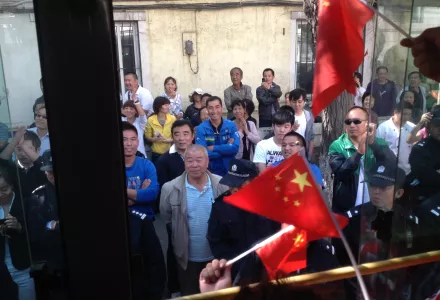 Protesters on demonstration bus interacting with police and pedestrians during 918 Shenyang Anti-Japan Demonstration, September 18, 2012.
