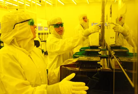 Technicians in clean room learn to make semiconductors