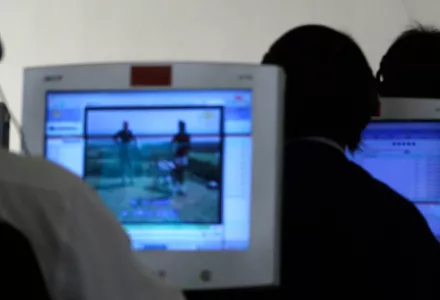 Rows of people using computers in North Korea.