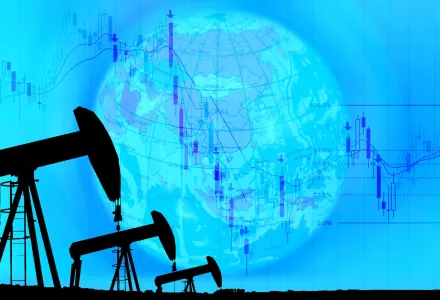 silhouetted oil rigs against blue background