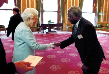 Calestous Juma meets with Queen Elizabeth II at Buckingham Palace to celebrate the first Queen Elizabeth Prize for Engineering 