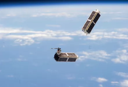 A set of NanoRacks CubeSats is photographed by an Expedition 38 crew member after the deployment by the Small Satellite Orbital Deployer (SSOD).