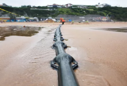 Final installation of Marea transatlantic undersea cable on shore in Bilbao, Spain.