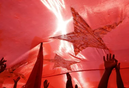 Protesters hold up a giant Chinese national flag during protests outside the Japanese embassy in Beijing, China, Saturday, Sept. 15, 2012.