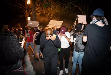 Protesters react to tear gas at George Floyd protests in Washington, D.C.