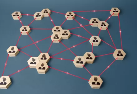 A blue abstract background with hexagon shapes being connected via a red line.