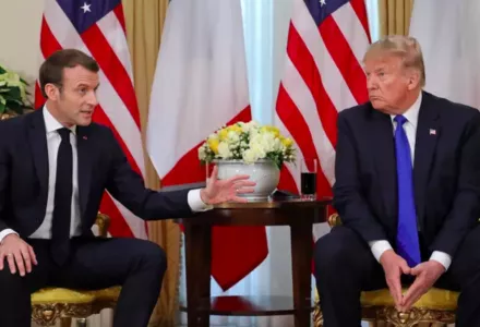 U.S. President Donald Trump talks with France’s President Emmanuel Macron during their meeting at Winfield House in London on December 3, 2019.