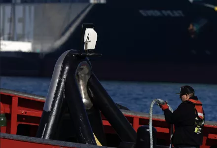 A worker is seen in a tugboat at the Port of Los Angeles on Nov. 10, 2021.