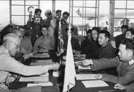 In this July 27, 1953, file photo, US Maj. Gen. Blackshear M. Bryan, left, exchanges credentials with North Korean Lt. Gen. Lee Sang Cho at the opening session of the Military Armistice Commission at the Panmunjom Conference House.