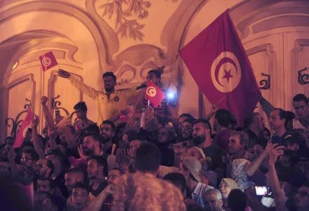 A crowd gathers on Tunis' main avenue, Sunday, Oct. 13, 2019. Tunisian polling agencies are forecasting that conservative law professor Kais Saied has overwhelmingly won the North African country's presidential election. 