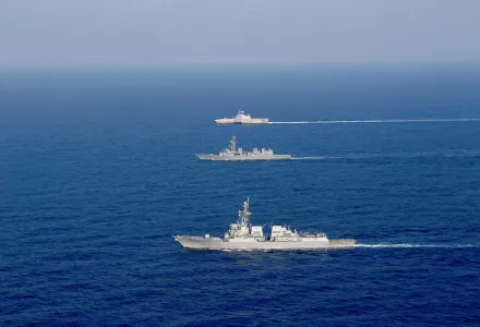 The Arleigh Burke-class guided-missile destroyer USS Dewey (DDG 105), front, and the Independence-variant littoral combat ship USS Gabrielle Giffords (LCS 10), rear, conduct joint operations with the Japan Maritime Self-Defense Force destroyer JS Akebono (DD-108) in the South China Sea