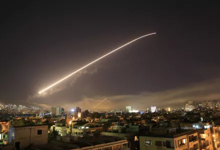 The Damascus sky lights up with missile fire as a U.S.-led coalition launches an attack early Saturday, targeting different parts of the Syrian capital. Hassan Ammar/AP