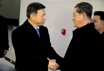 Song Tao, left, head of the International Liaison Department of the Central Committee of the Communist Party of China, is greeted by Ri Chang Gun, vice department director of the C.C., Workers' Party of Korea after arriving with his delegation, Nov. 17, 2017, in Pyongyang