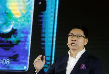 Richard Yu, CEO of Huawei Technologies' consumer business group, unveils a smartphone compatible with the company's new 5G chipset.  