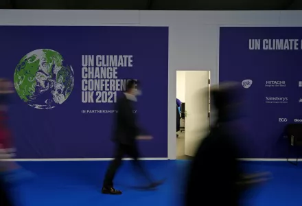 Delegates walk through the venue of the COP26 U.N. Climate Summit in Glasgow, Scotland