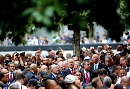 Former New York City Mayor Rudy Giuliani, Donald Trump, and New Jersey Governor Chris Christie talk in the World Trade Center 9/11 Memorial in Manhattan, NY, on September 11, 2016.