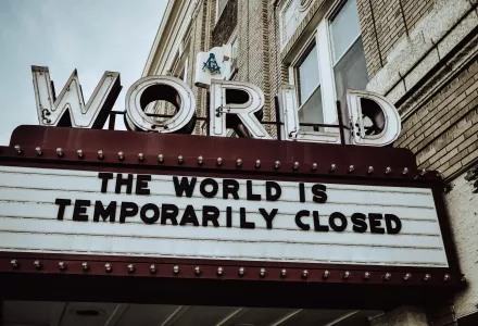 The World Theater's sign reads: "The World is Temporarily Closed"