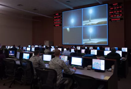 Members of the 576th Flight Test Squadron monitor an operational test launch of an unarmed Minuteman III missile