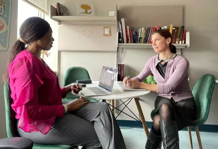 Ada Ezeokoli and Mariana Budjeryn sit at a table and have a conversation