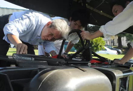 Dr. Hiroyuki Obara inspects his solar-hydrogen vehicle