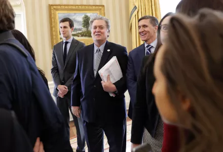 Kushner, Bannon, Flynn at White HIn this Jan. 27, 2017, photo, from left, White House senior advisers Jared Kushner, Steve Bannon and National Security Adviser Michael Flynn are seen in the Oval Office of the White House in Washington during a meeting between President Donald Trump and British Prime Minister Theresa May. The Trump administration is playing down the significance of a National Security Council restructuring. ouse