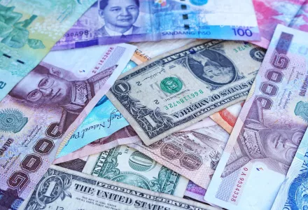 A photograph of the U.S. dollar among international bank notes.