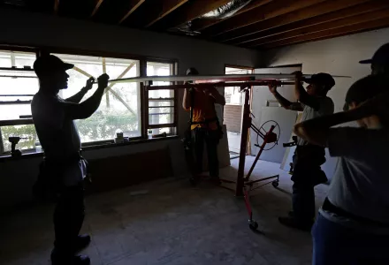 volunteers from Baptists On Mission and Home Builders Institute work at the home of Clifton Hall, assisting with ongoing repairs due to damage caused by Hurricane Florence