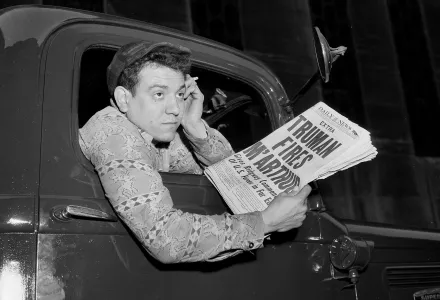 Truck Driver holds newspaper with Truman Fires MacArthur headline