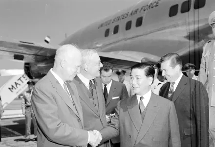 U.S. President Dwight D. Eisenhower and Secretary of State John Foster Dulles (from left) greet South Vietnamese President Ngo Dinh Diem at Washington National Airport