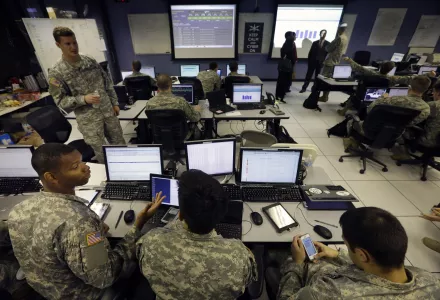 U.S. Military Academy cadets watch data on computers