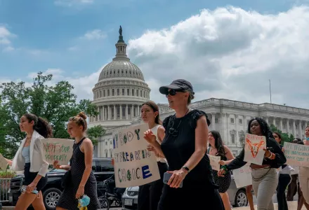 A group of abortion-rights protesters march past U.S. Capital building 