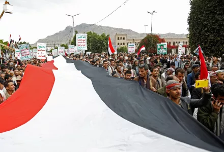 Houthi supporters chant slogans holding signs reading "Death to America, Death to Israel"