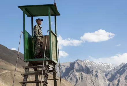 A Tajik conscript looks out over remote stretches of northern Afghanistan from a border outpost near Khorog, Tajikistan.