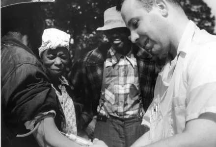 Doctor drawing blood from a patient as part of the Tuskegee Syphilis Study