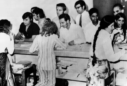 Ugandan Asians have their papers examined by ship's officer of the SS Haryana before they boarded the ship