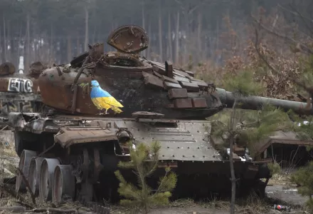 A destroyed Russian tank with an artwork depicting a dove with an olive branch by famous street artist TvBoy, amid Russia's attack on Ukraine, in the village of Dmytrivka, outside Kyiv, Ukraine Monday, Jan. 30, 2023.