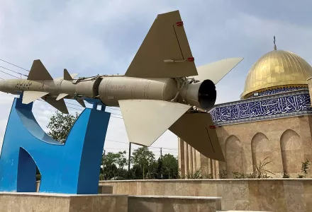 A missile is on display with a sign on it reading in Farsi: "Death to Israel" in front of a mosque in the shape of Dome of the Rock