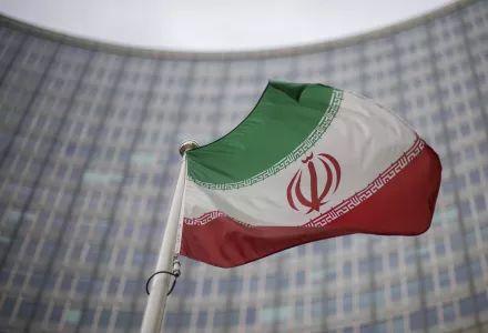 A national flag of Iran waves in front of the building of the International Atomic Energy Agency, IAEA, in Vienna, Austria, Friday, Dec. 17, 2021. 