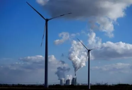 coal-fired power plant operates near wind turbines